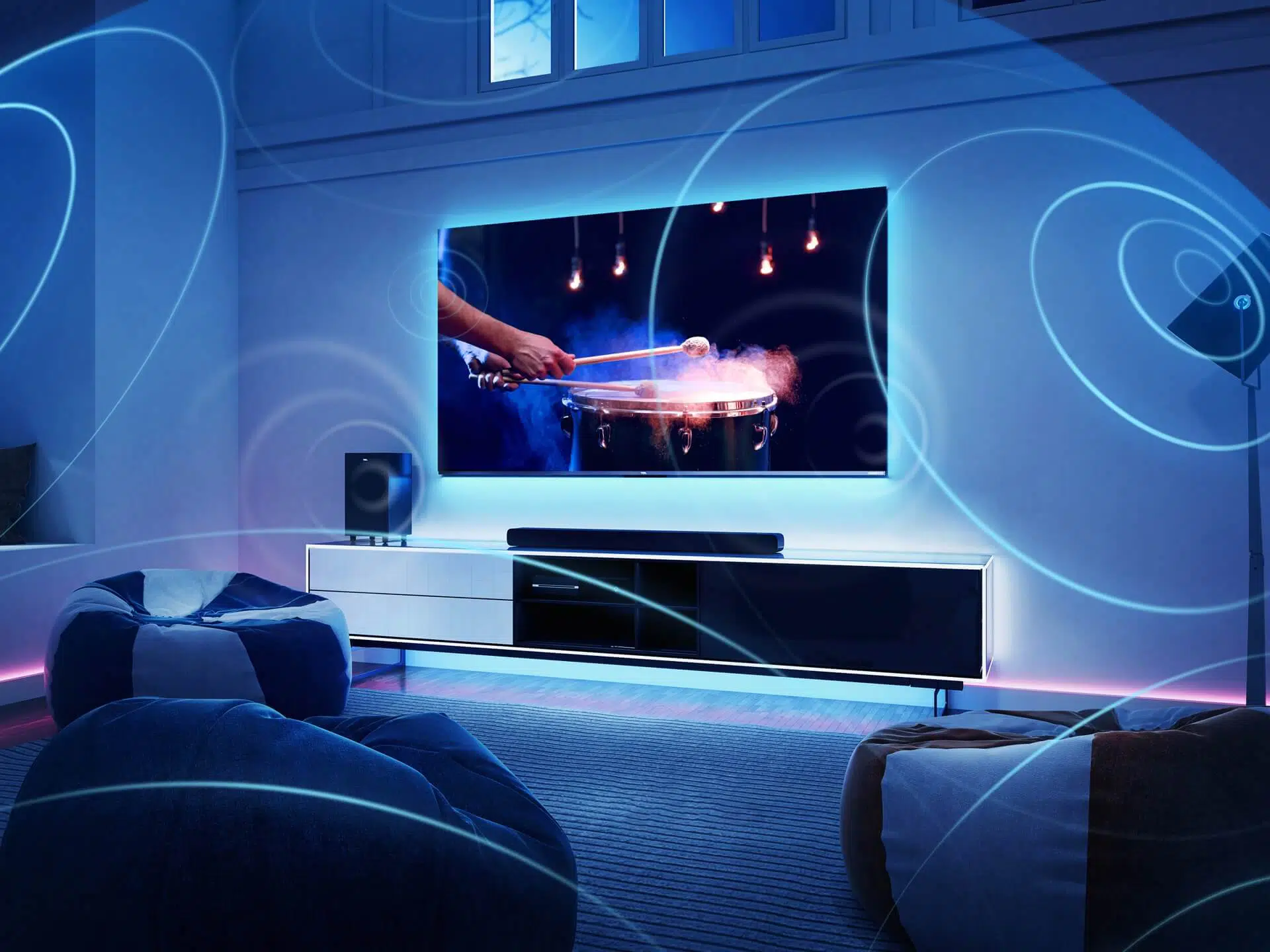 An image showcasing the audio setup of the TCL C735 Smart TV, highlighting the Dolby Atmos technology and the premium ONKYO sound system.