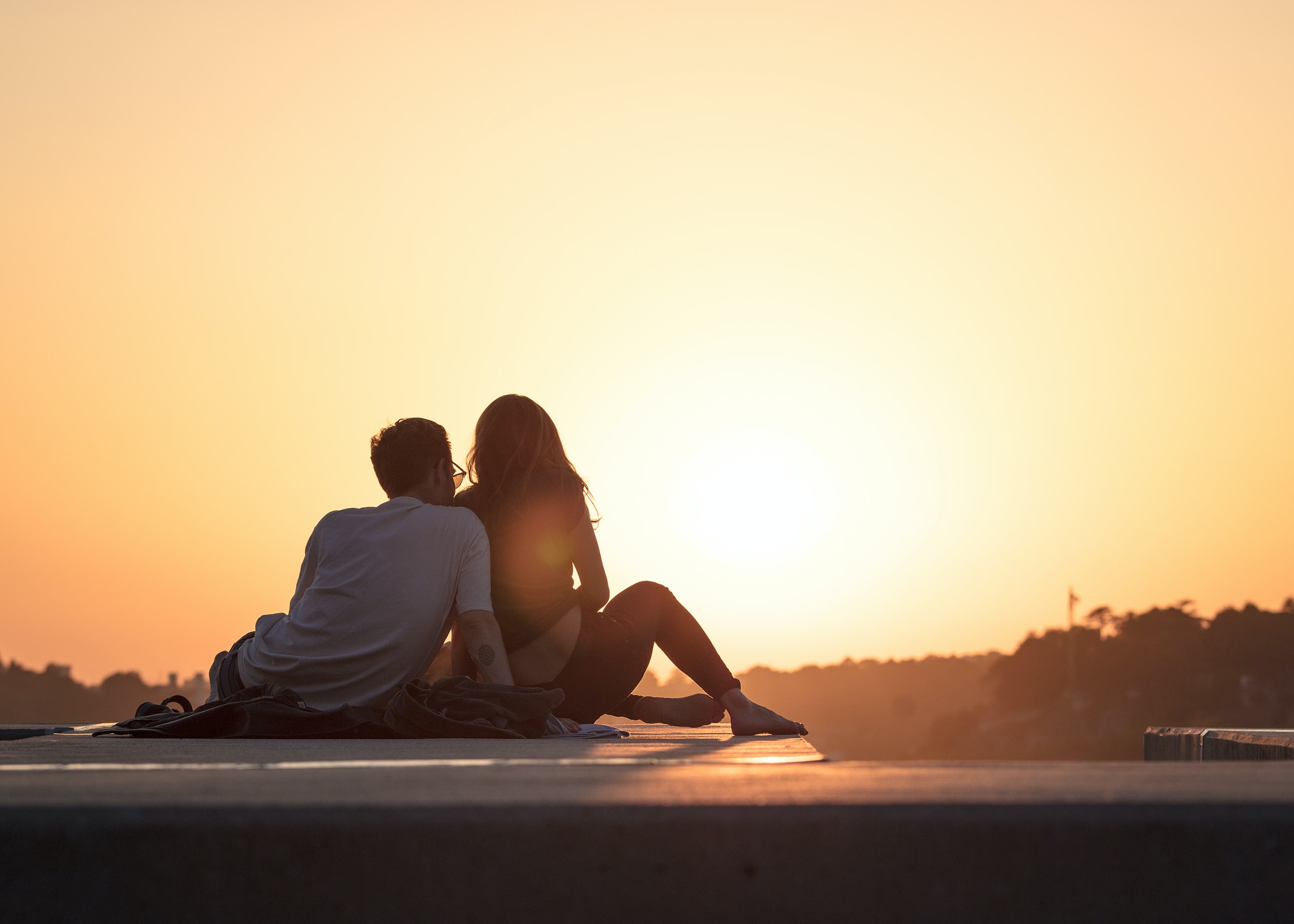 couple watching sunset in the Danube Delta