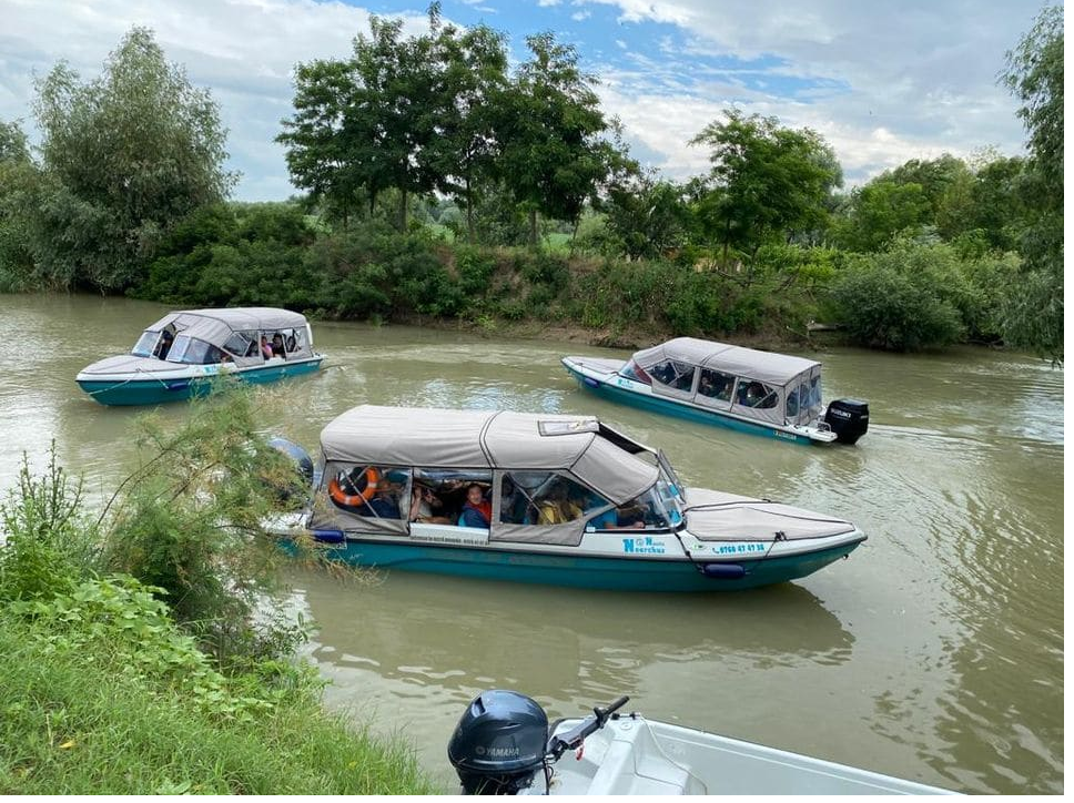 danube delta boats in the middle of the Danube river