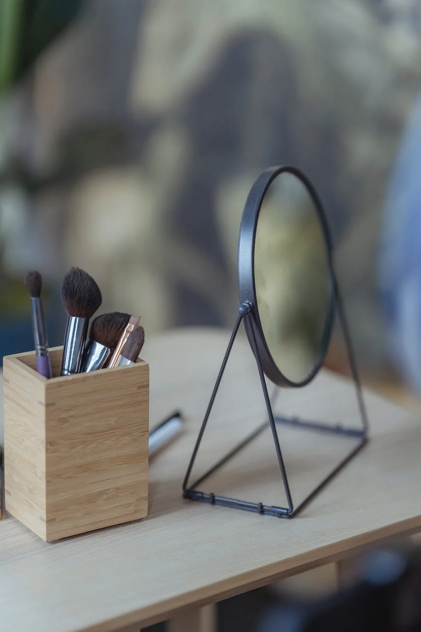 A magnifying makeup mirror sits as someone applies Beautifilipina Airy Lip Matte just out of frame.