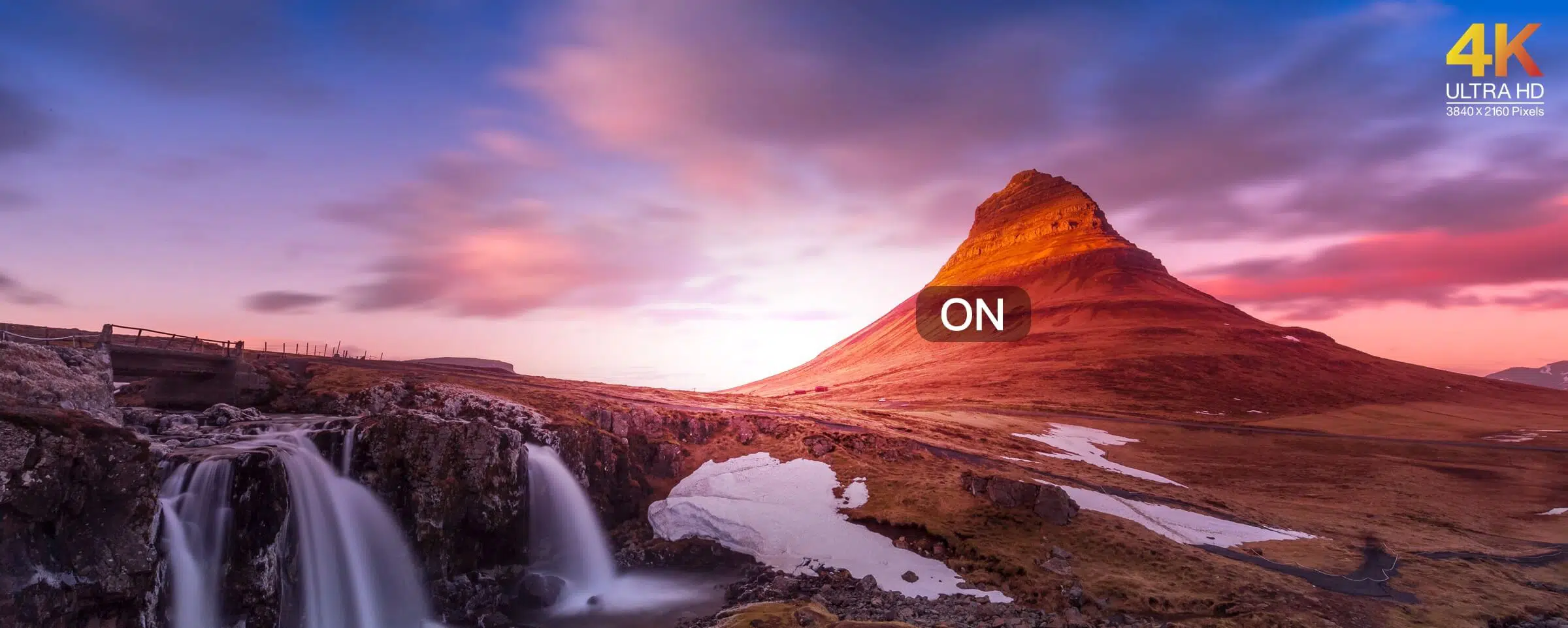 Image of a landscape with a wide range of brightness levels, such as a mountain range with snow-capped peaks and a sunlit valley below.